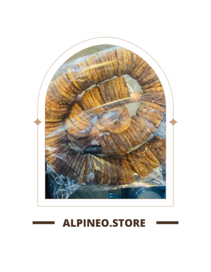 A close-up of a dry desi injeer (fig), wrinkled dark brown surface with a matte finish, on a neutral background.